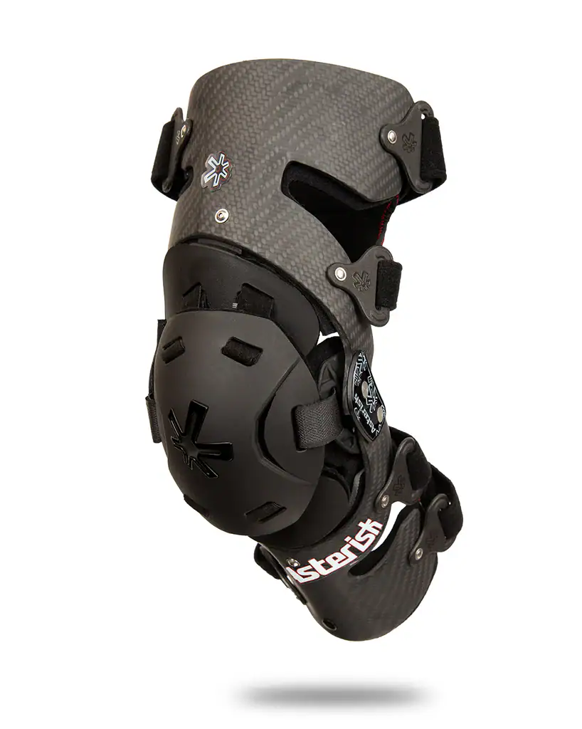 Protective knee brace with carbon fiber shell and adjustable straps for sports and outdoor activitie.