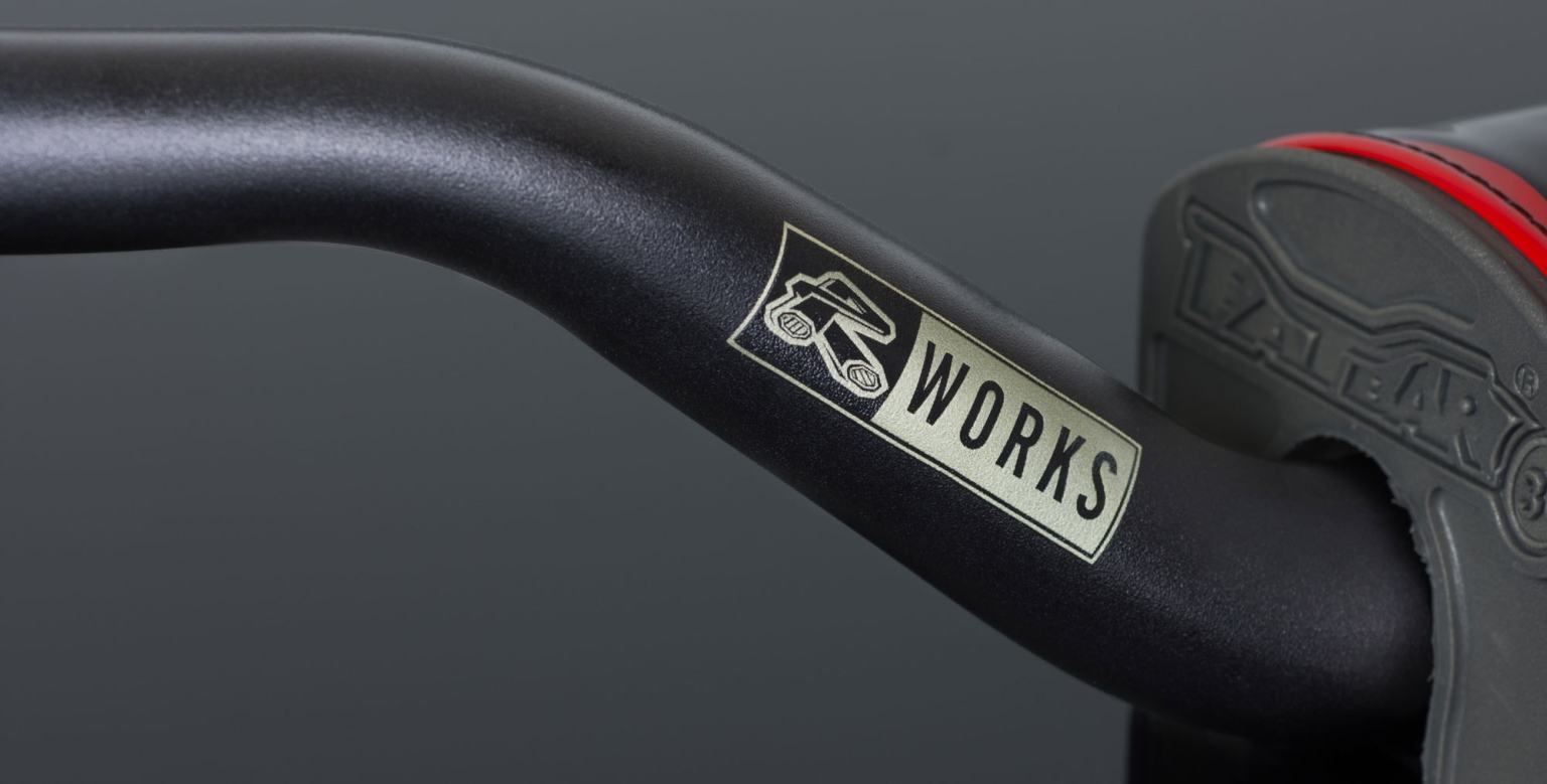 High-quality suspension bike fork with "WORKS" branding for enhanced performance and durability.